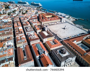 Aerial Drone Photo - Colorful Orange Roofs Of The Alfama District & The Comercio Square (Praça Do Comércio) Of Lisbon Portugal