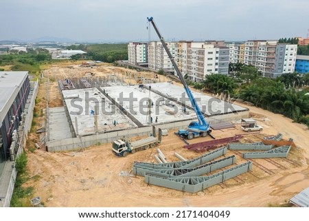 Aerial drone Photo  a construction site. Construction site shot Photo from Drone. Aerial Photo Busy Industrial Construction Site