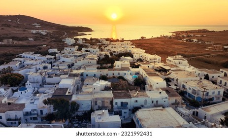 Aerial drone photo of famous Venetian fortified castle of main village in Antiparos island at sunset overlooking Sinfneiko beach, Cyclades, Greece - Shutterstock ID 2321992431