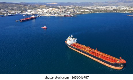 Aerial Drone Photo Of Huge Crude Oil And Fuel Tanker Ship Docked In Industrial Area Of Elefsina, Attica, Greece