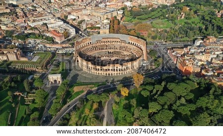 Aerial drone photo of iconic ancient Roman Gladiatorial arena world famous Colosseum, Rome historic centre, Italy