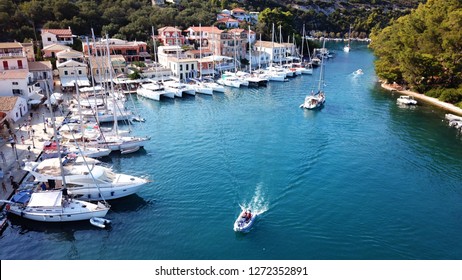 Aerial Drone Photo Of Iconic Seaside Village Of Gaios, A Safe Harbor For Yachts And Sailboats, Paxos Island, Ionian, Greece