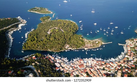 Aerial Drone Photo Of Iconic Seaside Village Of Gaios, A Safe Harbor For Yachts And Sailboats, Paxos Island, Ionian, Greece