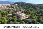 Aerial drone photo of iconic Temple of Hephaestus one of the most well preserved in Greece and Acropolis hill at the background, Athens historic centre, Attica, Greece