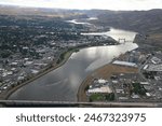 aerial drone photo of the lewiston Clarkston Valley featuring the confluence of the Clearwater and Snake Rivers and the commercial port districts along the rivers
