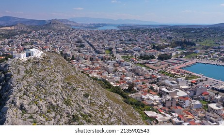 Aerial drone photo of main town of Salamina island as seen from small uphill chapel of Profitis Ilias, Saronic gulf, Greece
