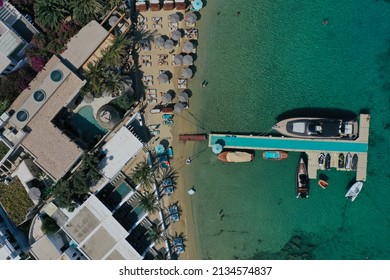 Aerial Drone Photo Of Most Popular Beach Club In Mykonos In Psarrou Beach With Tirquoise Water In Greece