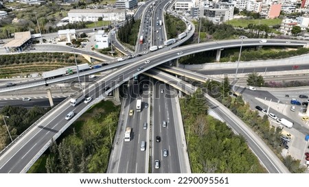 Aerial drone photo of multilevel bridge highway road interchange
passing near urban residential area during rush hour