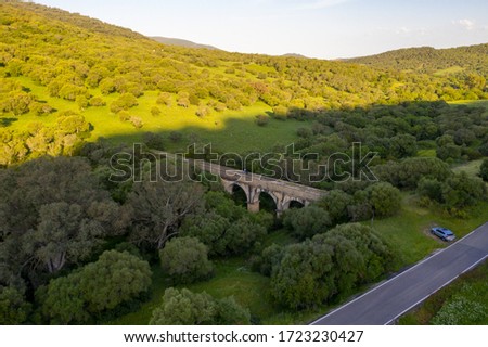Aerial Drone photo of nature preservered park with an old midevil bridge in Spain
