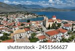 Aerial drone photo of picturesque fishing village of Galaxidi and landmark church of Agios Nikolaos, Fokida prefecture, Greece