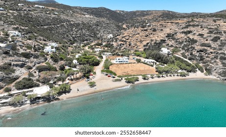 Aerial drone photo of sandy beach of Chrysopigi known for clear waters and nice taverns with traditional food next to famous chapel, Sifnos island, Cyclades, Greece - Powered by Shutterstock