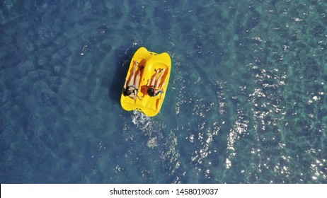 Aerial drone photo of sea bike with couple paddling in tropical exotic turquoise sea
