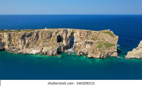 Aerial Drone Photo Of Small Islet Of Tsihli Baba With Iconic Rocky Arch And Monument Of French Naval Forces In Battle Of Navarino Next To Sfaktiria Island, Pylos, Peloponnese, Greece