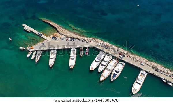 Aerial drone photo\
of small port in lemos area of Vouliagmeni with luxury yachts,\
Athens riviera, Attica,\
Greece
