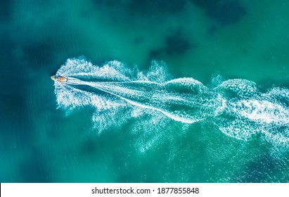 Aerial Drone Photo Of Stunt Man Performing Extreme Stunts With Jet Ski Water Craft Over The Black Sea At Dusk