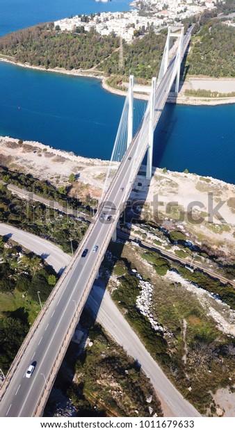 Aerial drone photo of suspension bridge\
connecting an island with\
mainland
