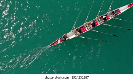 Aerial Drone Photo Of Team Of Athletes Rowing In Sport Canoe In Tropical Exotic Lake