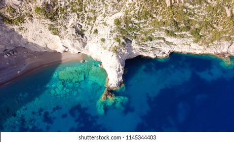 Aerial drone photo of tropical volcanic cave beach with turquoise clear sea - Powered by Shutterstock