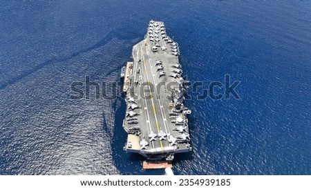 Aerial drone photo of USS Gerald R. Ford latest technology nuclear powered aircraft carrier anchored in deep blue open ocean sea Stock foto © 