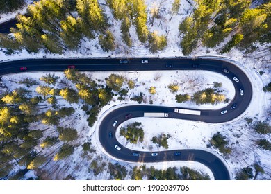 Aerial drone photograph bird's eye perspective of a beautiful winding mountain road in Romania in winter time  - Powered by Shutterstock