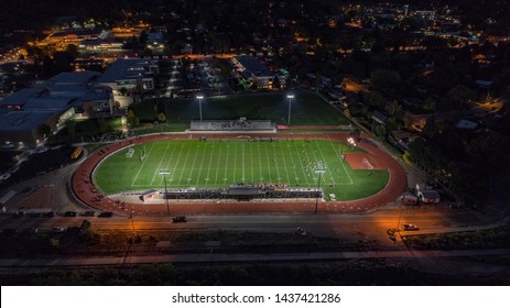 Aerial Drone Picture Of An American High School Football Game Played At Night In Glenwood Springs, Colorado.