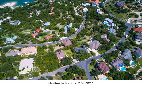 Aerial Drone Point Of View Homes And Houses In Community Suburb Around Lake Travis Near West Lake Outside Austin , Texas Right On The Water Of The Colorado River Or Lake Travis