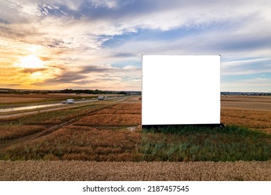 Aerial Drone Shot Of Big Blank Billboard Near Busy Highway Or Motorway At Sunset