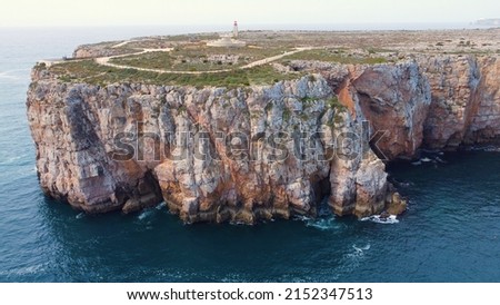 An aerial drone shot of the cliffs near the sea in Lagos, Ponte de Piedade, Portugal