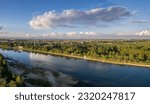 aerial drone shot of Cremona and the river Po before sunset, the bridge, the beach, the park. Lombardy, Italy