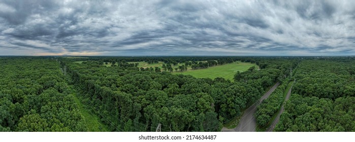 An Aerial Drone Shot Over Green Treetops On A Cloudy Day. There Are No People In Sight  The Scene Looks Like A Painting. Taken Over A Peaceful  Quiet Park Area On Long Island, NY.