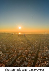 Aerial Drone Shot Of Rising Sun Over Barcelona City Beach