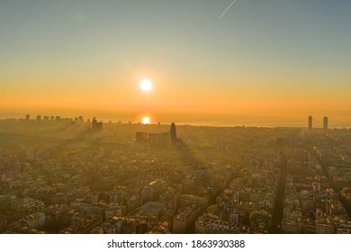 Aerial Drone Shot Of Rising Sun Over Barcelona City Beach