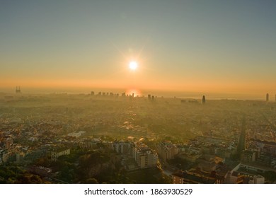 Aerial Drone Shot Of Rising Sun Over Barcelona City Beach