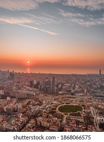 Aerial Drone Shot Of Rising Sun Over Barcelona City Beach