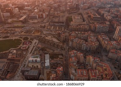 Aerial Drone Shot Of Rising Sun Over Barcelona City Beach