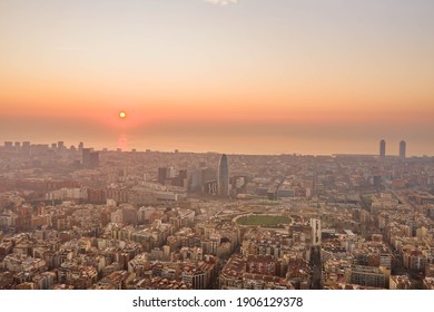 Aerial Drone Shot Of Rising Sun Over Barcelona City Beach