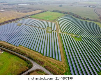 Aerial Drone Shot. Solar Panels Farm In A Field Near Sittingbourne In Kent, England.