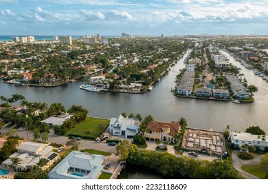 Aerial drone shot of sunrise key neighborhood in Fort Lauderdale, you can see the Rio Barcelona canal, modern and luxury houses, blue sky boats and tropical climate - Shutterstock ID 2232118609