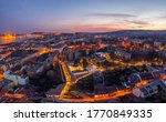 Aerial drone shot of Tomb of Gul Baba with lights on in Budapest sunset