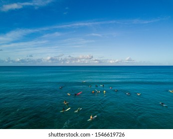 Aerial Drone Shot View Of Surfers In Pacific Ocean Near Waikiki Beach, Honolulu, Hawaii