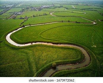 Aerial Drone Shot Of A Winding River In English Countryside.