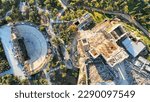 Aerial drone top down photo from iconic ancient theatre of Herodes Atticus and Propylaea Acropolis hill main entrance, Athens historic centre, Attica, Greece                              