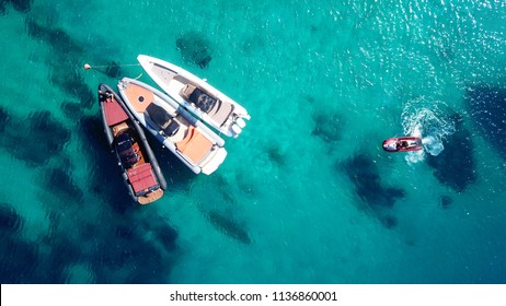 Aerial Drone Top View Of Docked Inflatable Speed Boats In Tropical Emerald And Sapphire Sea