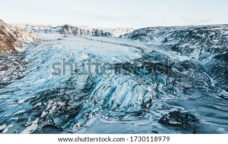 Aerial drone top view glacier iceland Sólheimajökull, Melting Ice, Climate Change and Global Warming Concept 