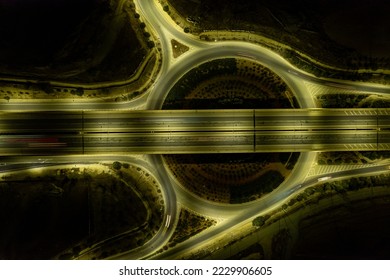 Aerial drone top view of motorway junction. Roundabout with cars moving. Transportation infrastructure, Nicosia Cyprus