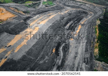 Aerial drone top view Open pit mine, extractive industry for coal mineral truck, Cut of soil with layers of minerals clay. Stock photo © 