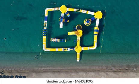 Aerial Drone Top View Photo Of Inflatable Water Park Located In Mediterranean Destination Sandy Beach