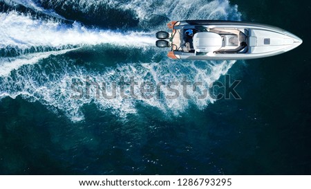 Aerial drone top view photo of luxury inflatable rib speed boat cruising in high speed in mediterranean deep blue sea