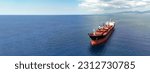 Aerial drone ultra wide panoramic photo with copy space of huge industrial bulk carrier tanker anchored in deep blue Aegean sea