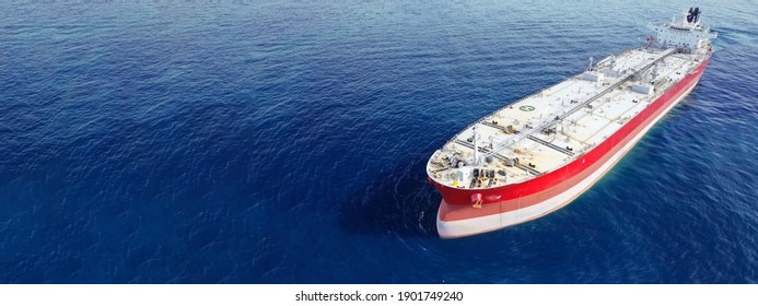 Aerial drone ultra wide panoramic photo of huge crude oil tanker anchored in open ocean deep blue sea